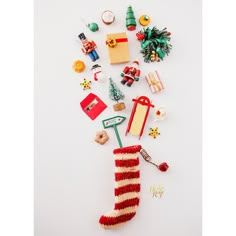 an assortment of christmas items are arranged in the shape of a stocking