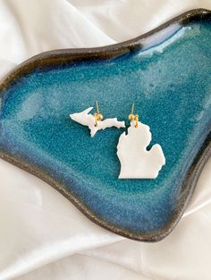 My one true home. These little Michigans are a gorgeous pearly ivory color. Lightweight polymer clay with gold-plated ball studs, silicone backs included. Approximately 1.25 in x 1 in White Resin Pierced Earrings, Gold Polymer Clay Jewelry For Wedding, Gold Polymer Clay Wedding Jewelry, Gold Matte Finish Jewelry Gift, Matte Finish Gold Jewelry Gift, Cream Jewelry With Matching Earrings For Gift, White Handmade Jewelry Souvenir, Elegant White Resin Jewelry, Elegant Matte Finish Jewelry For Gifts