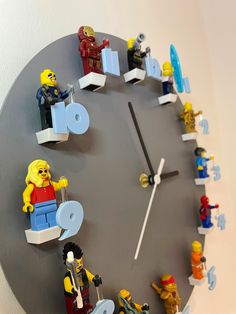 a clock made out of legos on the wall