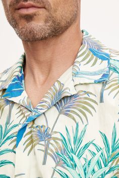 Hello vacation! A warm weather essential is the classic camp shirt and this is our take on this casual button down in a bold print that is just the right amount of eye-catching. A relaxed fit in a cotton woven. Green Printed Camp Shirt For Spring, Spring Printed Green Camp Shirt, Printed Camp Collar Shirt For Beach Season, Casual Collared Hawaiian Shirt For Beach, Summer Vacation Short Sleeve Shirt With Johnny Collar, Vacation Short Sleeve Shirt With Camp Collar, Casual Patterned Camp Shirt For Spring, Johnny Collar Short Sleeve Shirt For Summer Vacation, Casual Patterned Hawaiian Shirt With Camp Collar