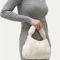 Discover Your New Fashion Favorite Step out in style with the Plush Faux Fur Hobo Handbag, a perfect blend of elegance and practicality. This handbag is not just an accessory; it's a statement piece that complements any outfit, whether you're on a casual day out or a special evening event. Its versatile design ensures it fits seamlessly into any wardrobe, making it ideal for all your fashion needs. Exceptional Features Material: Luxurious faux fur that's soft to the touch yet durable. Size: Compact yet spacious - 9.8x2.6x5.9", perfect for your essentials. Interior: Includes a handy cell phone pocket to keep your phone accessible. Multiple Carrying Options: Comes with a long shoulder strap and a short handle for varied styles. Closure: Secure zipper closure to keep your belongings safe. Sty Winter Double Handle Shoulder Bag For Everyday Use, Everyday Winter Satchel With Double Handle, Everyday Winter Double Handle Satchel, Fall Handheld Hobo Bag, Rectangular Winter Shoulder Bag, Winter Satchel Shoulder Bag For Errands, Winter Shopping Top Handle Bag, Winter Shopping Shoulder Bag With Double Handle, Versatile Everyday Bags For Winter