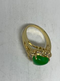 Vintage Lucky Green Nephrite Jade Gold Filled Cocktail Ring Large green nephrite jade gold filled Vintage ring, does not tarnish Size 5.75, 6, 7, 7.5, 8, 8.75 All rings are shipped free in the US in a nice gift box. Check out our over a THOUSAND great reviews Engraving is $4 per letter and is not always perfect depending on the piece. It can take a few days if the jeweler is busy. This is payable to Paypal Judithsltd@gmail.com Gold Jade Emerald Ring, Fine Jewelry Gold Jade Rings, Gold Jade Rings In Fine Jewelry Style, Fine Jewelry Gold Rings With Jade, Formal Gold Jade Rings, Green Opal Ring Spiritual Style, Green Opal Spiritual Ring, Green Hallmarked Opal Ring, Cocktail Vintage