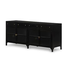 a black sideboard with brass knobs and drawers