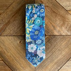 Our Seth Tie displays a mesmerizing blend of blue, yellow, white, and green floral patterns. A great tie for a summer night or a spring afternoon! Details: ➢ 100% Cotton ➢ 60.25” x 2.25” Summer Formal Ties With Floral Print, Blue Summer Tie, Summer Floral Print Tie, Summer Floral Print Ties, Summer Floral Print Standard Tie, Multicolor Standard Tie For Summer, Yellow Summer Ties, Spring Floral Print Tie, Blue Spring Tie