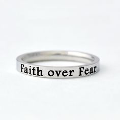 "This listing is for one stainless steel band ring, engraved with \"Faith over Fear\" on the outside.  It makes a best gift for friends, sisters in Christ or yourself. Always be reminded to embrace faith over fear. Materials & Features: This ring is made of high quality hand polished solid stainless steel, which is hypoallergenic (good for metal-sensitive skin). Stainless steel will not tarnish, its luster and durability will make it last for many years. The black text on the ring will not fade