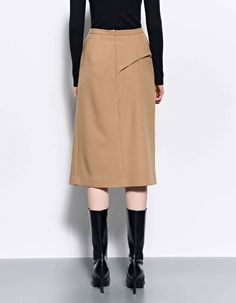 - Midi skirt with draping & pleated details - Back concealed-zip & hook closing- Regular fit, stretchy fabric- Lining Made in Korea COMPOSITION- BODY 1 : POLYESTER 70%, RAYON 28%, ELASTANE 2% - LINING : POLYESTER 100% SIZE SPEC The model wears size S.Model sizesHeight 173cm / Bust 27.5" / waist 24" / Hip 35"Regular fit LENGTH WAIST HIP HEM S 65.5 66.5 45 50.5 M 66.5 71.5 47.5 53 L 67.5 76.5 50 55.5 CARE- Dry Clean (Check the care instructions.)