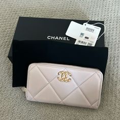 Chanel 19 Ling Wallet In Beautiful Light Color. Official Color Is Light Purple But It Almost Look Like A Light Rose. Never Been Used And Have All The Original Packaging Including The Box, The Ribbon And Dust Bag. Have Authenticity Card As Well. Designer Evening Wallet With Zipper Closure, Luxury Evening Wallet With Zipper Closure, Luxury Rectangular Wallet With Zipper Closure, Luxury Rectangular Wallets With Zipper Closure, Elegant Evening Wallets With Zipper Closure, Light Purple Color, Chanel 19, Light Rose, Rose Lights