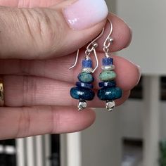 These earrings are handmade and stacked with neon apatite, lapis lazuli, chrysocolla and sterling Hill Tribe silver. Each bead complements the next in these multi gem earrings. Ear wires, headpins and accent beads are all sterling silver. * Total length including ear wire: 1.5 inch * Neon apatite Rondelle: 10mm Your jewelry will arrive in a cotton lined kraft box within a padded postal envelope. I use USPS first class mail. This usually takes 3 to 5 days to ship. International orders outside of Nickel-free Apatite Dangle Jewelry, Blue Apatite Gemstone Earrings, Blue Sterling Silver Earrings With Gemstone Beads, Blue Apatite Earrings For Gift, Blue Apatite Earrings Gift, Blue Earrings For Gift, Stack Earrings, Pyrite Earrings, Stacked Earrings