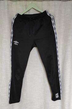 Functional Umbro sport pants, slim fit . Trousers has two secure side pockets and expandable leg openings, embroidered logo and white stripes finish the look. Length- 100cm, inseam-77cm, leg openings-15cm. Size S. Adidas Stretch Sportswear Pants, White Training Bottoms With Elastic Side Panels, Sports Sweatpants With Three Stripes, White Sports Bottoms With Contrast Stripes, White Bottoms With Three Stripes For Gym, White Training Bottoms With Side Stripes, Sporty Training Pants With Three Stripes Branding, Sporty Training Pants With Three Stripes, Sporty Stretch Pants With Three Stripes Branding