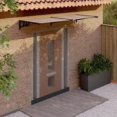 a small building with a door and planters on the outside