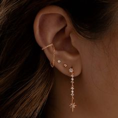 a woman's ear is shown with three different types of piercings