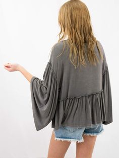 The softest of the soft. This mineral wash baby doll top features bell sleeves and a ruffle hemline. It's super comfy and the best throw on top you can find. SIZE & FIT Fit is true to size Model is 5'6" wearing size small Baby Doll Top, Babydoll Top, Baby Doll, Baby Dolls, Bell Sleeves, Dye, Boutique, How To Wear, Quick Saves