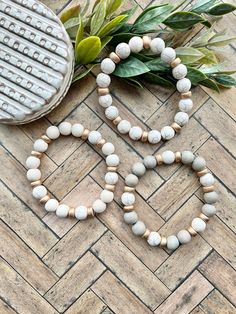 Add a stacking bracket to one of the chunky white cross bracelets!  White wood beaded bracelet. Cream howlite. Gold accents. Light gray wood beads. Measures 7.5 inches.  Send a message if you need a smaller or more generous size! Neutral Bracelet, Neutral Bracelets, Stacked Beaded Bracelets, Clay Bracelets, West Lafayette, Wood Bead Bracelet, Clay Bracelet, Wood Bracelet, White Crosses