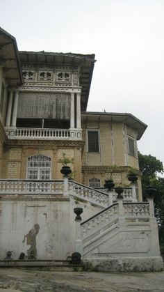 an old building with stairs leading up to it