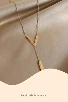 Trendsetting V-Neck Gold Clavicle Necklace Gold Y-shape Necklace For Formal Occasions, Trendy Lariat Necklace As A Gift, Trendy Lariat Necklace For Gift, Clavicle Chain Y-shape Drop Necklace, Formal Gold Y-shaped Necklace, Minimalist Gold Drop Necklace For Party, Gold Y-shape Clavicle Chain Necklace, Minimalist Dangle Necklaces For Parties, Modern Long Necklace For Party