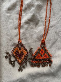 4 unique pairs of colourful burnt orange and gold Middle Eastern beaded  necklaces. I only have one of each so message which one you like when buy ❤️ Can be worn as spiritual protection, in ceremony or every day.   Made by loving indigenous hands in the heart of the Middle East. this beadwork is very different style to that of Central America, it is traditional work from the markets of Arabic countries in the Middle East. can be gift wrapped Handwoven Orange Beaded Earrings For Gift, Luxury Orange Spiritual Beaded Necklace, Spiritual Hand-strung Amber Beaded Necklaces, Orange Beaded Amulet Necklace, Bohemian Hand-strung Orange Beads, Orange And Gold, Spiritual Protection, Beaded Necklaces, Central America