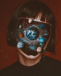 a man with his face covered in planets