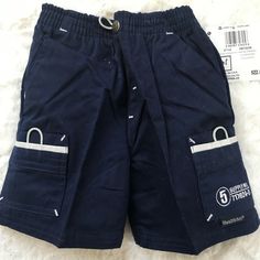 NWT Healthtex Boys Cargo Shorts, Size 2T Navy. 100% Sturdy Cotton Pull on with full elastic waist (faux snap and fly). 2 front pockets, 2 rear pockets and 2 cargo pockets with nylon self-closure Original Price $22.00 Condition is "New with tags". Shipped with USPS First Class. Playtime Bottoms With Pockets And Short Length, Short Bottoms With Pockets For Playtime, School Cotton Shorts With Pockets, Cotton School Shorts With Pockets, Boys Cargo Shorts, Mens Printed Shirts, Sewing Tutorials Clothes, Shorts With Pockets, Cargo Shorts