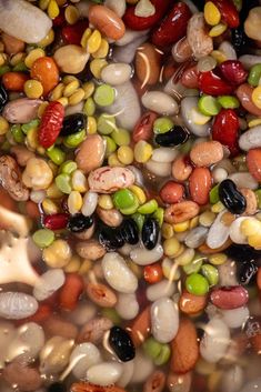 beans and corn are mixed together in a pot