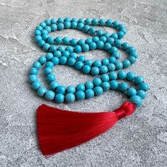 Turquoise Mala Necklace Turquoise Howlite 108 Mala Beads Necklace Hand Knotted Mala Yoga Jewelry Red Tassel Mala Bead Spiritual Necklaces -  8mm  Turquoise Howlite 108 beads -  10 mm Howlite Guru bead -  9cm Red tassel MY SHOP: https://www.etsy.com/shop/BonBonStones Please contact me with any questions. I'm happy to help! Spiritual Turquoise Necklace With Round Beads For Meditation, Turquoise Beaded Necklaces With 8mm Beads For Healing, Turquoise Beaded Necklace With 8mm Beads For Healing, Spiritual Turquoise Necklace With 8mm Beads, Spiritual Turquoise Beaded Necklace With 108 Beads, Red Beaded Necklace With 108 Beads For Meditation, Turquoise Beaded Necklaces For Meditation, Turquoise Beaded Necklaces With 8mm Beads For Meditation, Turquoise Beaded Necklace For Meditation With 8mm Beads