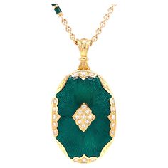 Victor Mayer oval pendant locket 18k yellow gold, Hallmark collection, emerald green vitreous enamel, guilloche, 25 diamonds, total 0.29 ct, H VS, brilliant cut, measurements app. 25.0 mm x 36.0 mm About the creator Victor Mayer Victor Mayer is internationally renowned for elegant timeless designs and unrivalled expertise in historic craftsmanship. Lovers of the extraordinary appreciate the beauty of Victor Mayer's designs, which use extremely rare techniques such as genuine enamel or elaborate Art Deco Pendant Necklace, Enamel Locket, Diamond Locket, Jewelry Photography Styling, Pendant Locket, Round Locket, Vitreous Enamel, Oval Locket, Gold Locket