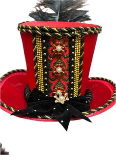 Classic Royal Nutcracker Top Hat Add elegant character to your Nutcracker shoots with the handmade Classic Royal Nutcracker Top Hat by The Head Mistress. A red satin top hat embellished with metallic jacquard trim, twisted satin rope, rhinestone buttons and embellishments and a velvet bow. A perfect addition to your nutcracker photo shoots! This lightweight top hat is fixed to a clip and fits all ages. Made in the USA Luxury Red Brimmed Top Hat, Luxury Red Elegant Top Hat, Nutcracker Hat Headband, Red Satin Top, Elegant Character, Steampunk Christmas, Fabric Photography, Velvet Bow, Satin Top