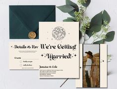 the wedding stationery is set up with an envelope, photo and wax stamp on it