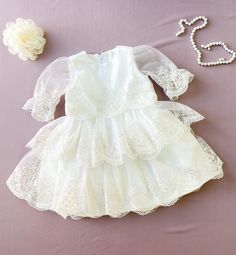 This gorgeous ivory lace dress is made for Baptism/Christening and First communion event. Fabric: ivory cotton, lace with floral print. The price is only for the dress. *Wash & care instructions: *Washing in cold water by hand. DELIVERY TIME (approximately): I need 3-5 days to sew your orders. Ship worldwide. Shipping to Europe usually takes 7-8 days, USA-7-8 days, Canada-14-20 days, Australia, NZ-2-3 weeks. Also you can choose express delivering 2-3 days for 29 dollars. It depends on the co White Lace Dress For Baptism In Spring, White Lace Dress For Spring Baptism, Spring First Communion Lace Dress, Elegant First Communion Dress For Spring, White Lace Baptism Dress For Spring, Spring First Communion Fitted Lace Dress, Elegant Spring First Communion Dress, Spring Lace Dress For First Communion, Fitted Lace Dress For First Communion In Spring