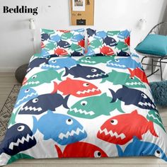 the bedding is decorated with colorful cartoon animals and fish on it's sheets