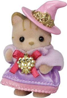 a small teddy bear wearing a purple dress and pink hat with a heart on it's chest