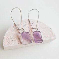 Where the timeless elegance meets modern vibes, that's where you'll find these drop earrings. GEMSTONE: Amethyst CLOSURE: Silver plated kidney ear wires LENGTH: 2" long Also available in other gemstones here. Minimalist Nickel Free Drop Crystal Earrings, Modern Purple Gemstone Earrings, Modern Crystal Drop Earrings Gift, Modern Crystal Drop Earrings For Gifts, Modern Drop Crystal Earrings For Gift, Everyday Hypoallergenic Purple Earrings, Everyday Gemstone Drop Earrings, Elegant Purple Earrings For Everyday, Nickel Free Amethyst Long Drop Earrings