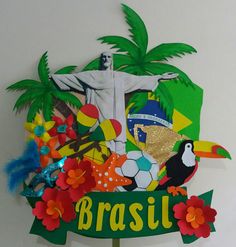 there is a sign that says brasil with many different things on it and a statue in the background