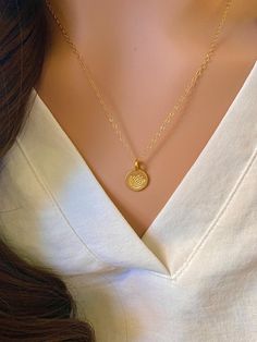 This is a gorgeous Gold Vermeil hand stamped lotus disc necklace. A precious necklace to add to your collection or gift to a friend, mother, or yoga enthusiast. - Pendant - Gold Vermeil  - Chain + Components - 14k Gold Fill - Lobster Clasp - 14k Gold Fill Also available in silver: https://www.etsy.com/listing/182938743/sterling-silver-stamped-lotus-disc Pair this disc necklace with the Itty Bitty Gold Disc necklace: https://www.etsy.com/listing/119133836/itty-bitty-gold-disc-necklace-gold . . . Dainty Medallion Jewelry Gift For Her, Dainty Medallion Jewelry As Gift For Her, Classic Heart Pendant Jewelry With Flower Charm, Dainty Heart Charm Round Necklace, Dainty Heart Charm Round Necklaces, Delicate Round Heart Charm Jewelry, Dainty Medallion Pendant Necklace For Gift, Dainty Medallion Pendant Necklace As Gift, Dainty Round Charm Necklace For Mom