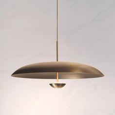 a modern light fixture hanging from a ceiling