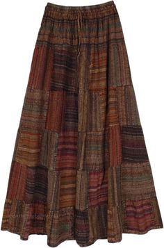 A gorgeous and understated boehmian skirt, this patchwork skirt is versatile enough to work in both summers and winters.  Pair it with the right accessories for the relative weather, a cool tank top for the summertime, and a cardigan and wool scarf for the winter. #tlb #Patchwork #Stonewash #MaxiSkirt #bohemianfashion #BohemianSkirt Long Clothes For Women, Gremlincore Skirt, Patchwork Skirts Long, Gremlincore Outfits Skirt, Goblincore Skirts, Long Hippie Skirt, Long Patchwork Skirt, Gremlincore Outfits Summer, Patchwork Tiered Skirt For Fall