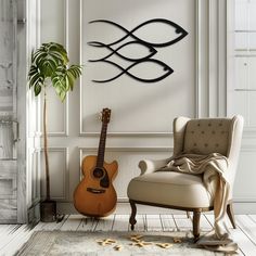 a room with a chair, guitar and fish sculpture on the wall next to a potted plant