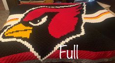 a crocheted blanket with the image of a cardinal logo on it and text that reads, full