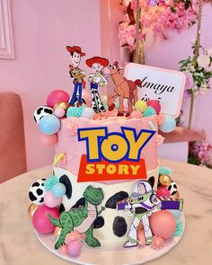 a toy story birthday cake on a table