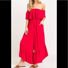 Flattering, Flowy And Fun, What Else Can You Say About About This Gorgeous Red Ruffle Jumpsuit! Featuring Pockets, Off The Shoulder Ruffle Detail, Smocked Waist, And Ruffle Tiered Relax Fit Bottoms. Perfect For Lounging, Brunching, Trips To The Beach, And All Your Favorite Weekend Activities. Fits True To Size Model Is Wearing A Size Small Fabric: 100% Rayon Casual Red Ruffled Jumpsuits And Rompers, Casual Red Jumpsuits And Rompers With Ruffles, Chic Red Strapless Jumpsuit For Spring, Chic Red Jumpsuit With Ruffles, Red Chic Jumpsuits And Rompers With Ruffles, Off The Shoulder Jumpsuit, Black And White Romper, Pleated Jumpsuit, Off Shoulder Jumpsuit