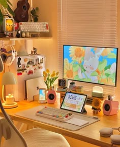 a desk with a computer, keyboard and mouse on it in front of a window