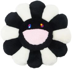 a black and white flower with multi colored eyes