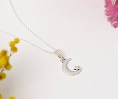 A dainty silver plated crescent moon and star necklace. The moon is 15mm in size and hangs from a dainty chain. You can then choose when length necklace you would like.  This necklace will arrive mounted onto card and wrapped in tissue paper or you can upgrade to a eco friendly gift box.  Matching earrings also available in our shop.  If you have any questions please don't hesitate to message me. Sterling Silver Star And Moon Charm Necklaces, Sterling Silver Star Charm Necklace With Moon Charm, Sterling Silver Charm Necklace With Moon And Star, Silver Crescent Charm Necklace With Star, Clay Mandala, Moon Jewellery, Moon And Star Necklace, Acorn Pendant, Star And Moon Necklace