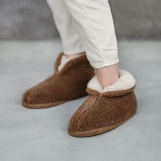 House slippers Camel Bronz These top-boot house slippers are made from 10% camel and 90% merino wool. They feature a firm non-slip bottom. A top-boot wool house slippers will ensure your legs will be warm, though you will never perspire wearing these top-boot slippers.  Wool is the perfect material for a slipper. This wonderful fiber regulates temperature and humidity to ensure you do not overheat. And, unlike that itchy old wool sweater you inherited, these wool house slippers are not scratchy. Boot Slippers, Temperature And Humidity, House Shoes, Style Expert, House Slippers, Slipper Boots, Brown Beige, Wool Sweater, Natural Wool