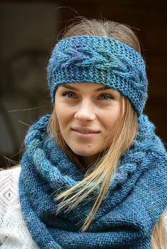 a woman wearing a blue knitted headband and scarf