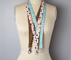 a mannequin wearing a multi colored lanyard with matching leashes on it