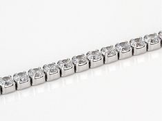 Bella Luce ® white diamond simulant 9.58ctw round, rhodium over sterling silver bracelet. Measures approximately 7 1/4"L x 1/8"W and has a hidden box closure. The diamond equivalent weight is 6.16ctw. Round Cubic Zirconia Diamond Bracelet With Polished Finish, Round Cubic Zirconia Diamond Bracelet, Silver Tennis Bracelet With Diamond-cut Cubic Zirconia, Silver Tennis Bracelet With Diamond Accents, Diamond White Sterling Silver Tennis Bracelet, Fine Jewelry Silver Tennis Bracelet With Diamond Accents, Modern Diamond White Cubic Zirconia Tennis Bracelet, Modern Cubic Zirconia Tennis Bracelet For Anniversary, Dazzling Silver Tennis Bracelet With Diamond Accents