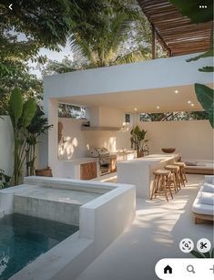 an outdoor living area with pool and patio furniture