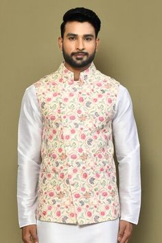 Yellow sleeveless bundi with botanical print and stitchline thread embroidery Paired with white full sleeve kurta and pant. - Aza Fashions Spring Wedding Nehru Jacket With Printed Motifs, Traditional Floral Print Bandhgala For Spring, Traditional Spring Bandhgala With Printed Motifs, Traditional Spring Bandhgala With Floral Print, Transitional Printed Nehru Jacket, Transitional Season Printed Nehru Jacket, Transitional Fitted Nehru Jacket With Printed Motifs, Traditional Fitted Nehru Jacket With Printed Motifs, Traditional Fitted Nehru Jacket With Floral Print