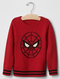 a red sweater with a spider - man face on it