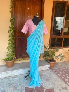 Pink blue mirror sequin saree | silk saree with blouse | designer modern party sequin saree | simple saree blouse | mirror work blouse | sarees USA | blue georgette saree with  blouse           so bored of regular saree styles ? Then You really deserve to own this unique stylish saree look for your upcoming occassion that really makes you stand apart in crowd !!            You dont really need to stress your self in finding matching blouses for our sarees !! we pretty much carry our sarees with trendy stitched blouses or we will help you with our mix and match collection !!           Presenting this beautiful georgette saree in beautiful powder blue color with sequin all over as in the picture was paired up with our light pink  designer mirror hand embroidery blouse in modern V neck and el Diwali Chanderi Pre-draped Saree With Mirror Work, Diwali Mirror Work Pre-draped Tissue Silk Saree, Diwali Pre-draped Tissue Silk Saree With Mirror Work, Diwali Tissue Silk Pre-draped Saree With Mirror Work, Traditional Draped Art Silk Saree With Mirror Work, Traditional Drape Art Silk Pre-draped Saree With Mirror Work, Semi-stitched Sequin Chanderi Pre-draped Saree, Semi-stitched Chanderi Pre-draped Saree With Sequins, Traditional Drape Pre-draped Saree With Mirror Work